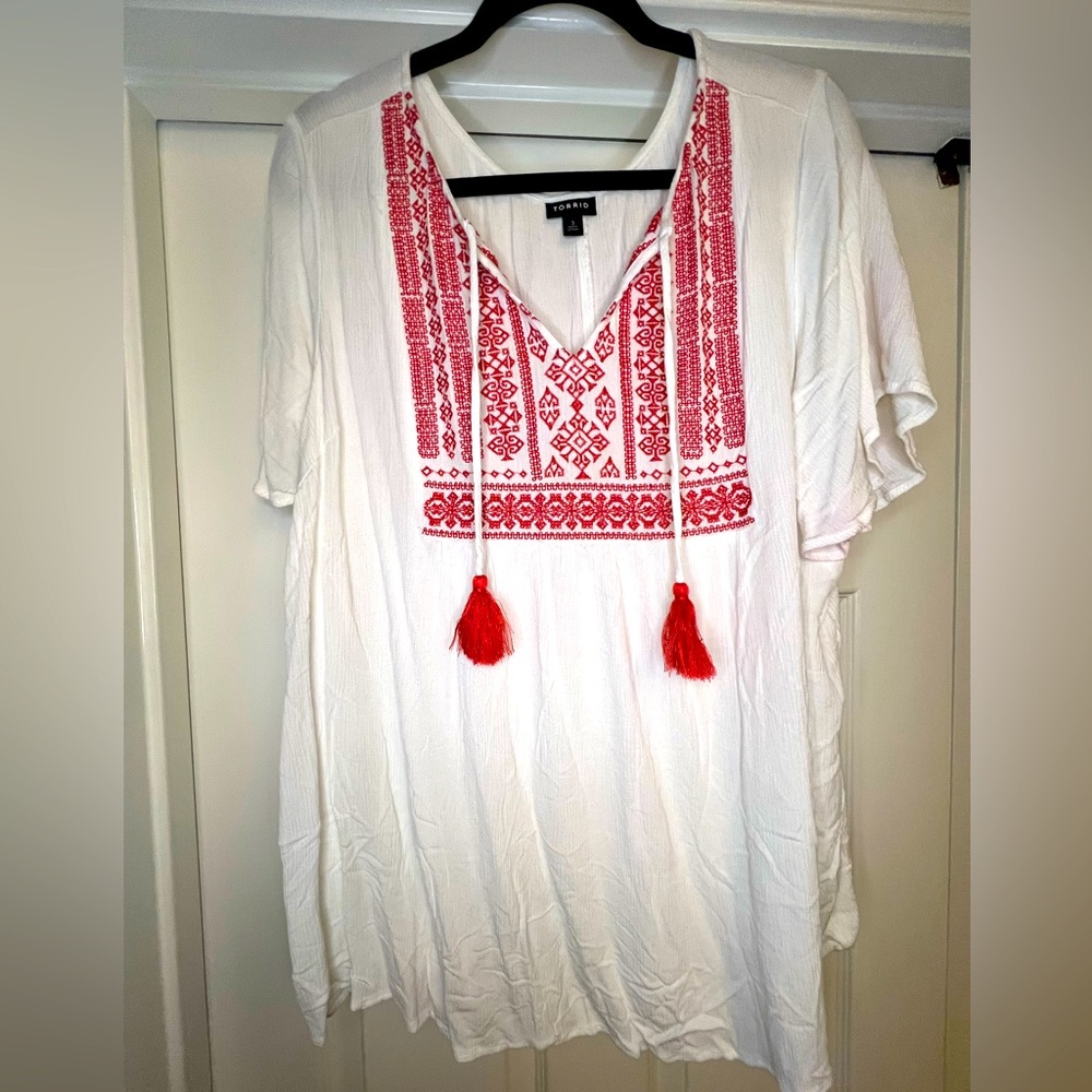 Torrid size 3X white top with red embroidery. Light & flowy & very flattering.